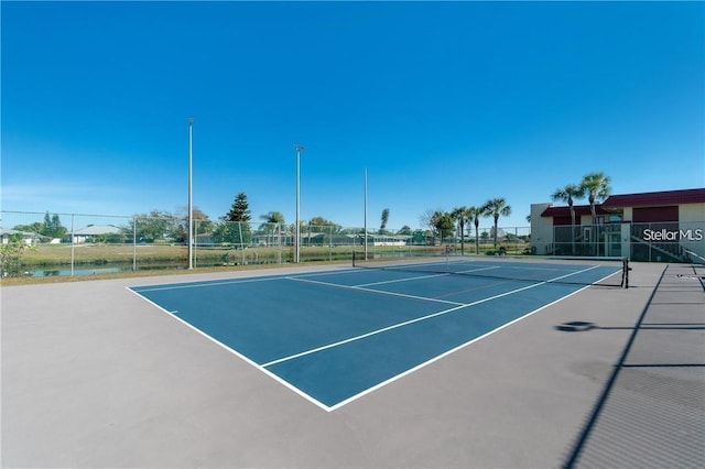 view of sport court featuring basketball hoop