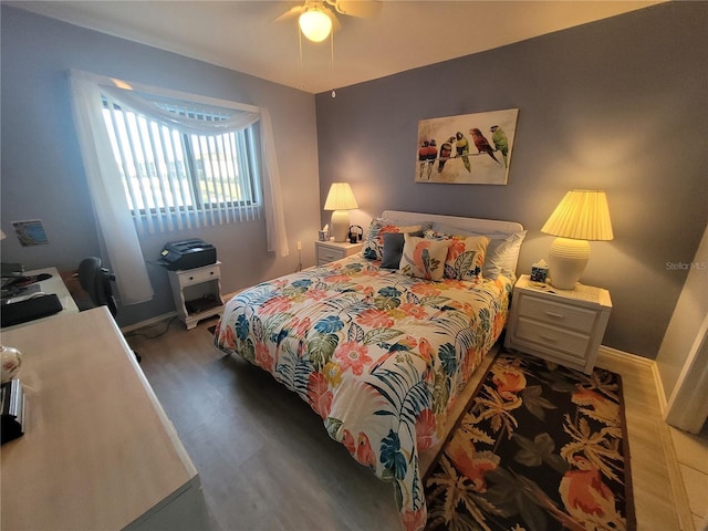 bedroom with ceiling fan and hardwood / wood-style floors