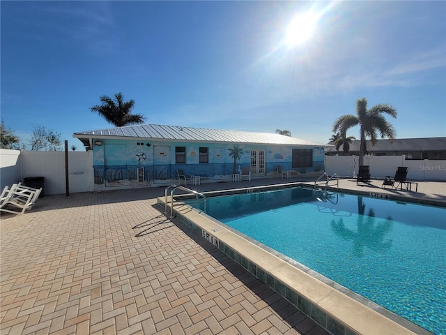 view of swimming pool featuring a patio area