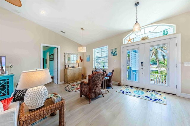 13104 Via Cassia, Placida, FL 33946 - foyer entrance with french doors, light wood-type flooring, and vaulted ceiling