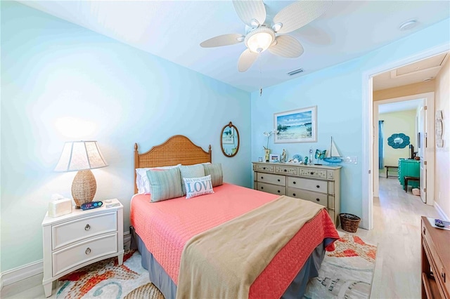 bedroom featuring light hardwood / wood-style floors and ceiling fan