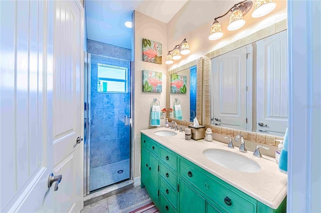 bathroom with vanity and a shower with door