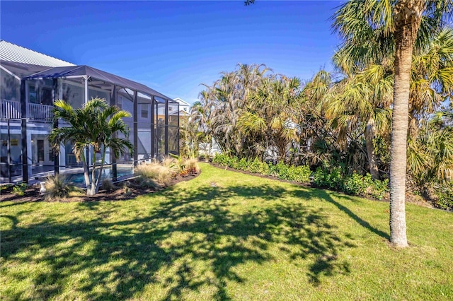 view of yard with a lanai