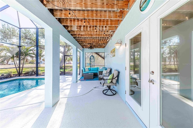 13104 Via Cassia, Placida, FL 33946 - view of patio / terrace with an outdoor pool, glass enclosure, and outdoor lounge area