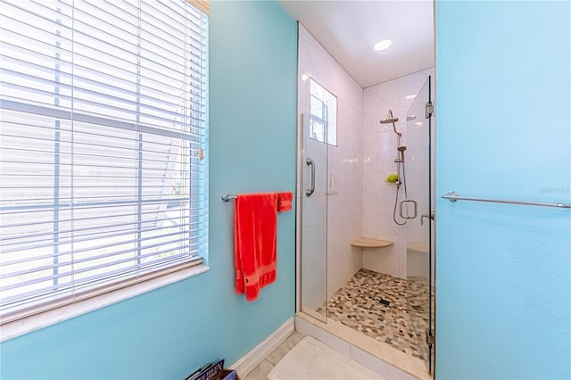 13104 Via Cassia, Placida, FL 33946 - bathroom with a stall shower and tile patterned floors