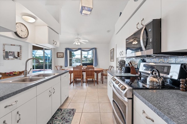 kitchen featuring sink, white cabinets, and stainless steel appliances