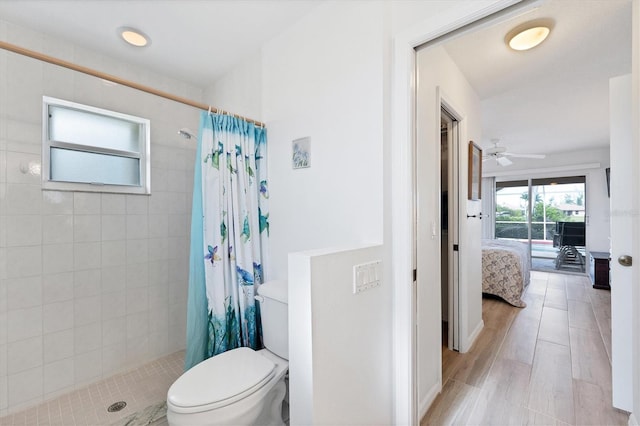 bathroom featuring a shower with curtain, hardwood / wood-style flooring, toilet, and ceiling fan