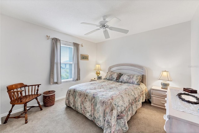 bedroom featuring ceiling fan and light carpet