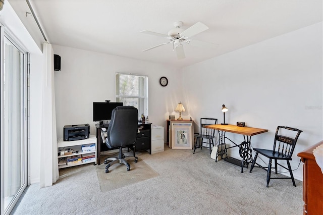 carpeted office with ceiling fan