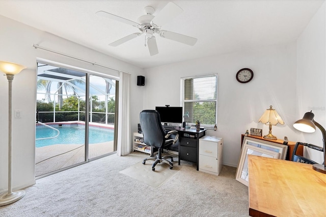 home office featuring ceiling fan and carpet