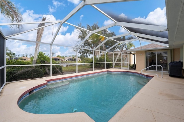 view of pool featuring a lanai and a patio