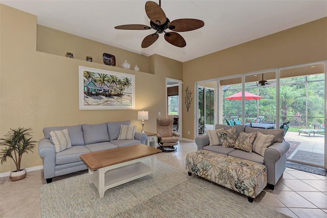 living room featuring ceiling fan and light tile patterned floors