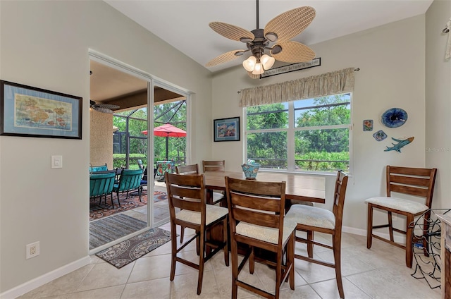 dining area featuring ceiling fan and light tile patterned floors