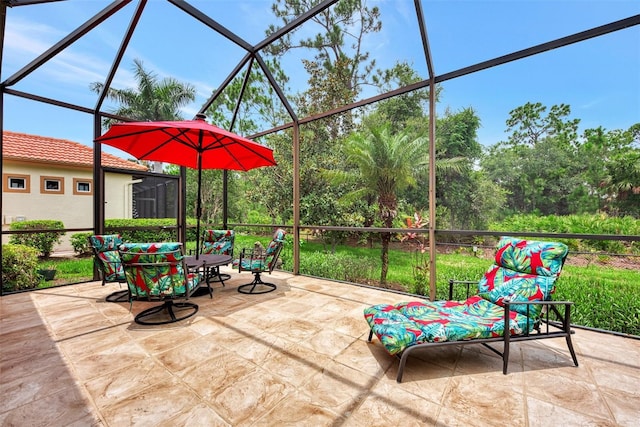 view of patio featuring a lanai