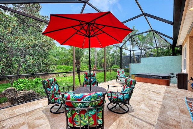 view of patio featuring a lanai and a hot tub