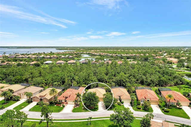 birds eye view of property with a water view