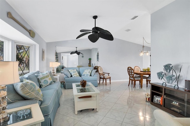 living room featuring ceiling fan with notable chandelier and vaulted ceiling