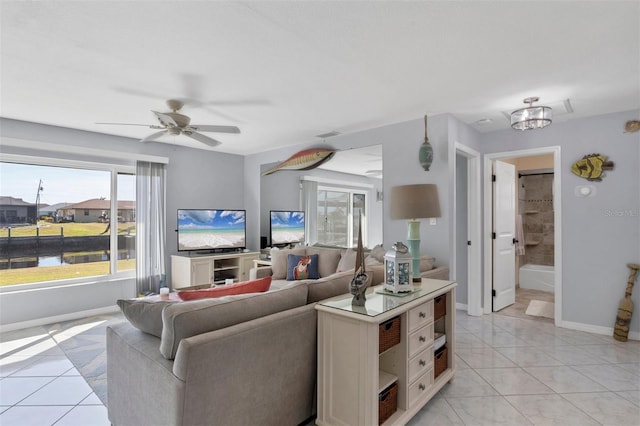 tiled living room with ceiling fan