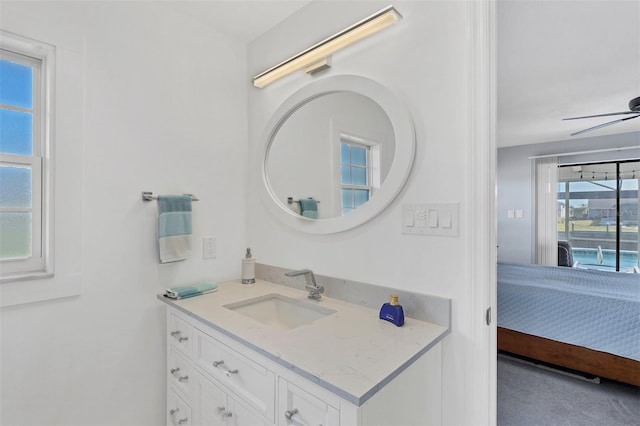 bathroom featuring ceiling fan, plenty of natural light, and vanity