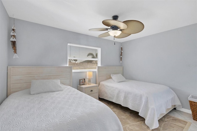 bedroom with tile patterned flooring and ceiling fan