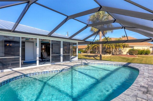 view of pool featuring a lanai and a patio area