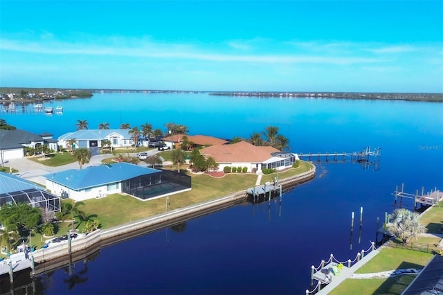 birds eye view of property with a water view