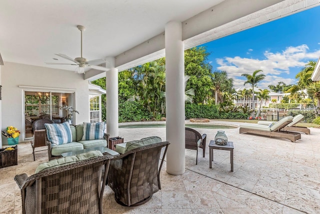 view of patio / terrace featuring ceiling fan and an outdoor living space