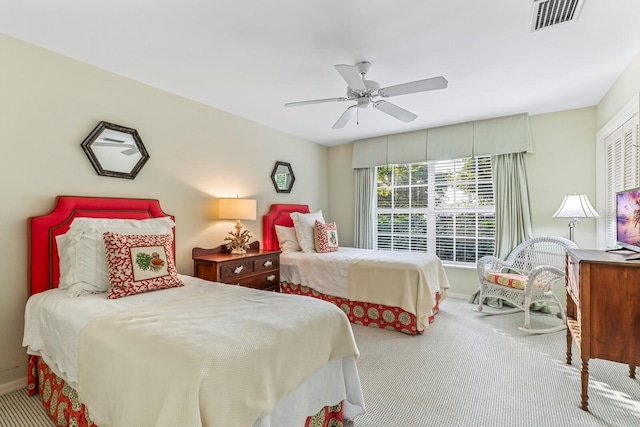 bedroom with ceiling fan and light colored carpet