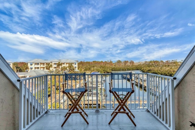 balcony featuring a water view