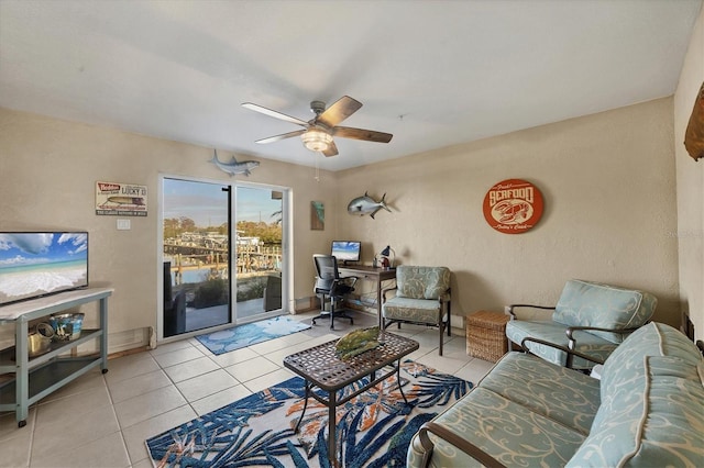 tiled living room featuring ceiling fan