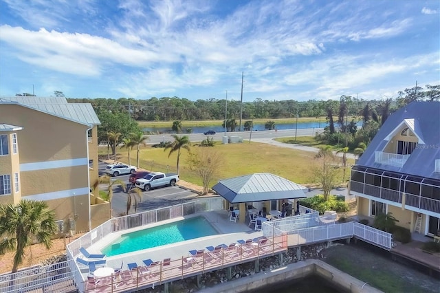 view of pool with a water view