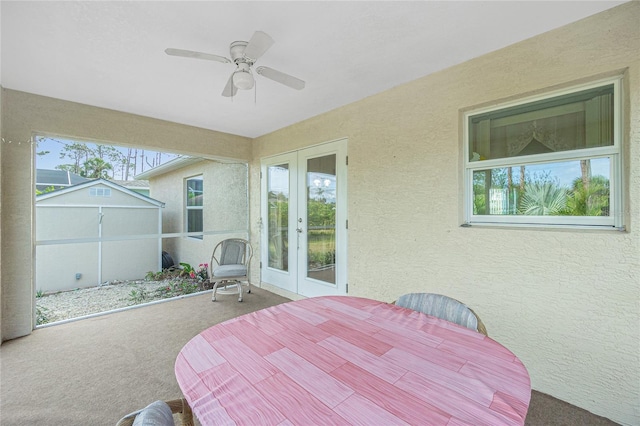 view of patio featuring ceiling fan and french doors