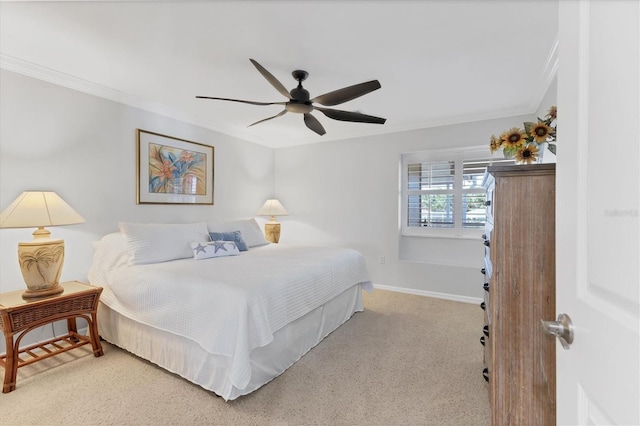 bedroom with ceiling fan, light colored carpet, and ornamental molding