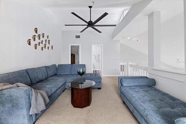 living room with ceiling fan and high vaulted ceiling