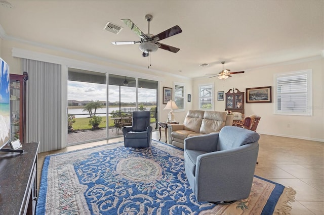 living room featuring ceiling fan, crown molding, and light tile patterned flooring