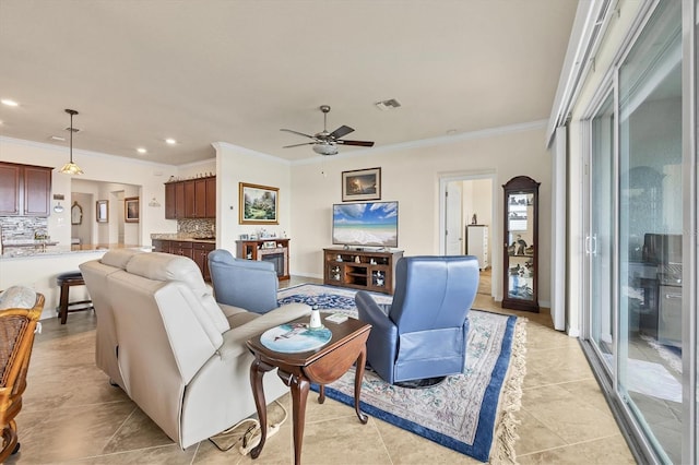 tiled living room featuring ceiling fan and crown molding