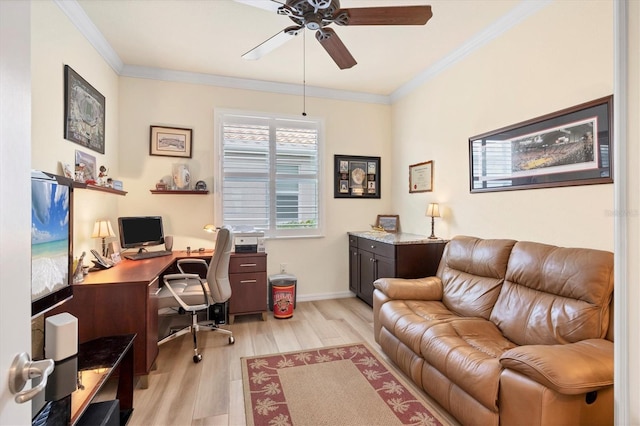 home office featuring ceiling fan, crown molding, and light hardwood / wood-style flooring