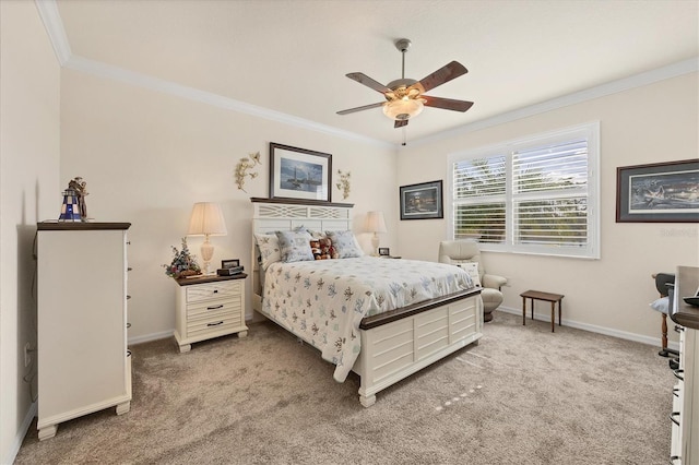 carpeted bedroom with ceiling fan and crown molding