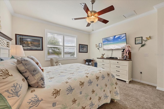 carpeted bedroom with ceiling fan and ornamental molding