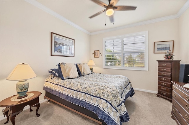 carpeted bedroom featuring ceiling fan and ornamental molding