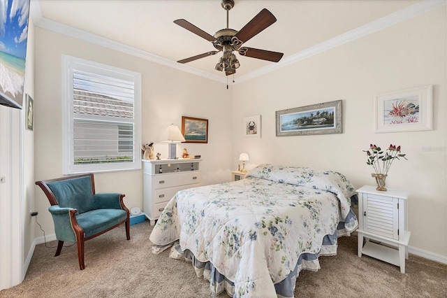 carpeted bedroom featuring ceiling fan and crown molding