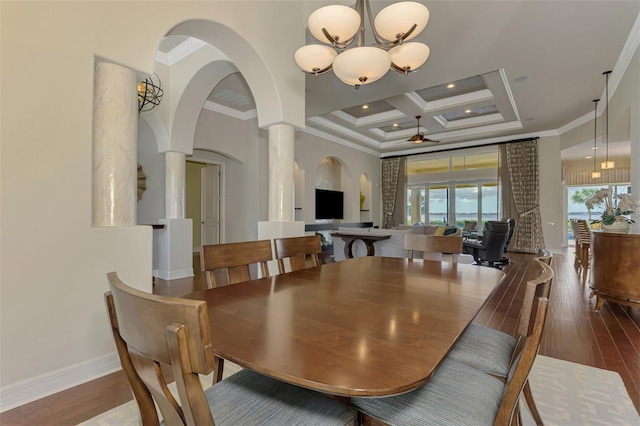 dining space with ornate columns, ceiling fan with notable chandelier, coffered ceiling, and ornamental molding