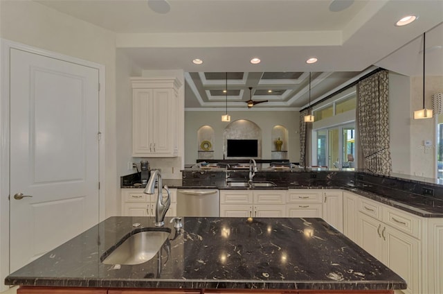 kitchen with dark stone counters, sink, hanging light fixtures, stainless steel dishwasher, and ceiling fan