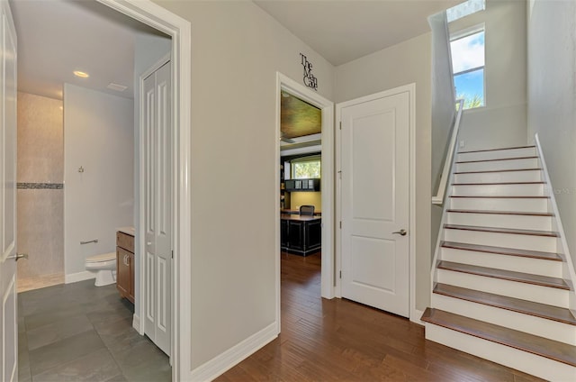 stairway with wood-type flooring