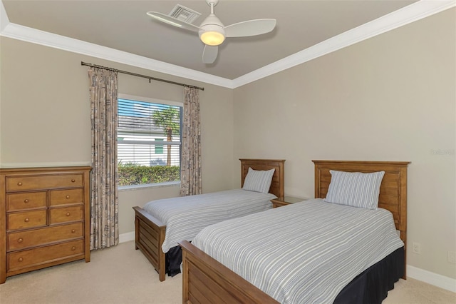 carpeted bedroom with ceiling fan and crown molding