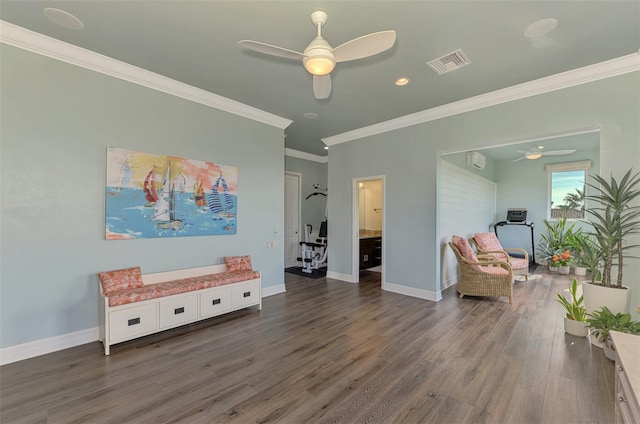 sitting room featuring dark hardwood / wood-style floors, ceiling fan, crown molding, and a wall mounted AC