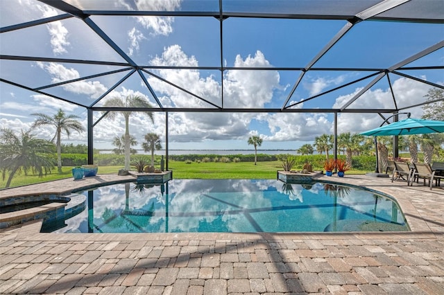 view of pool featuring an in ground hot tub, a patio, and glass enclosure