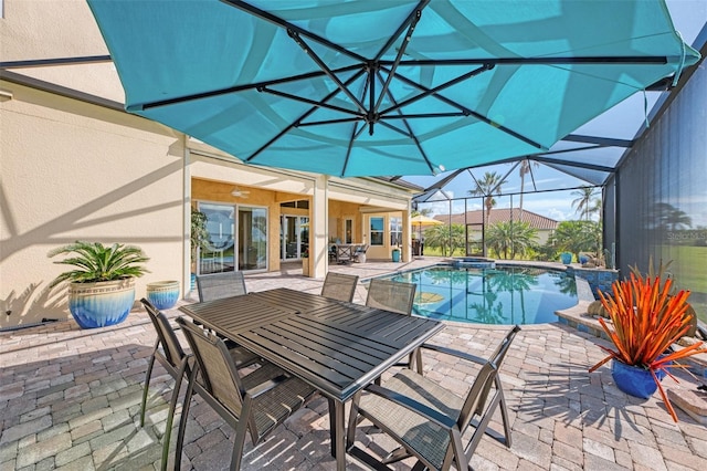 view of pool featuring glass enclosure and a patio