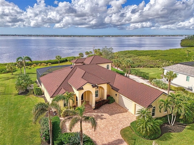 drone / aerial view with a water view