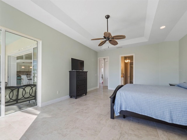 9567 Honeymoon Dr, Port Charlotte, FL 33981 - bedroom featuring a raised ceiling, ensuite bathroom, and ceiling fan